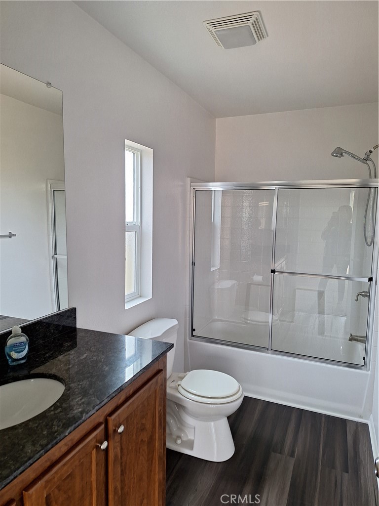 3708 Highway 140 Mariposa, CA 95338 - Photo 14 of 19 a bathroom with a granite countertop sink toilet a mirror and shower