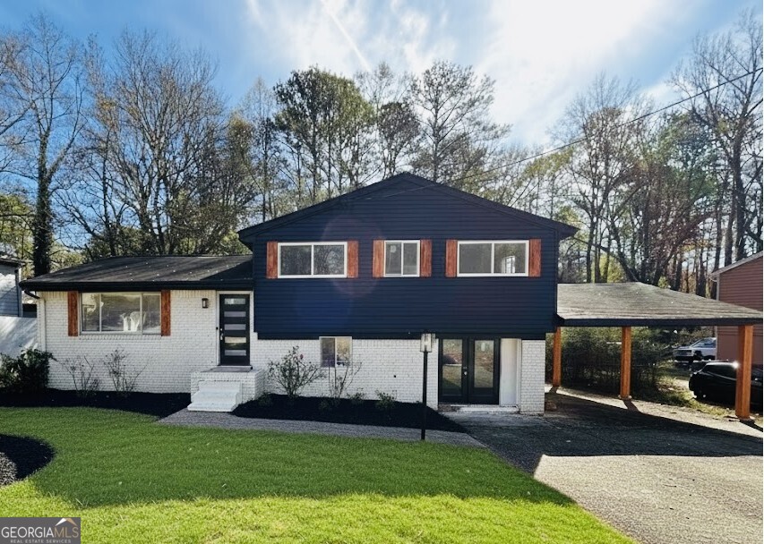 a front view of a house with a yard
