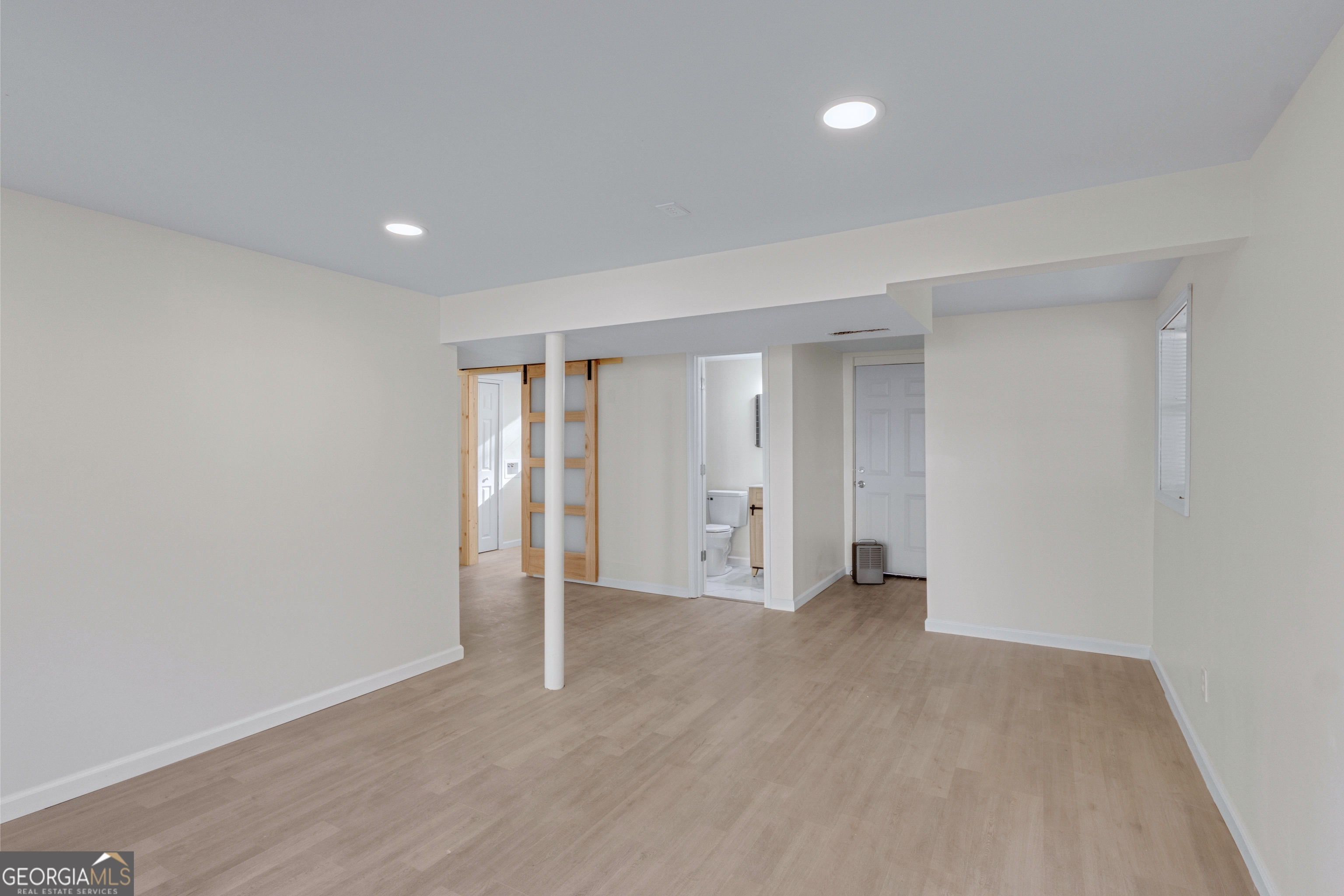 6695 Cedar Hurst Trail Atlanta, GA 30349 - Photo 19 of 23 a view of an empty room with a gallery