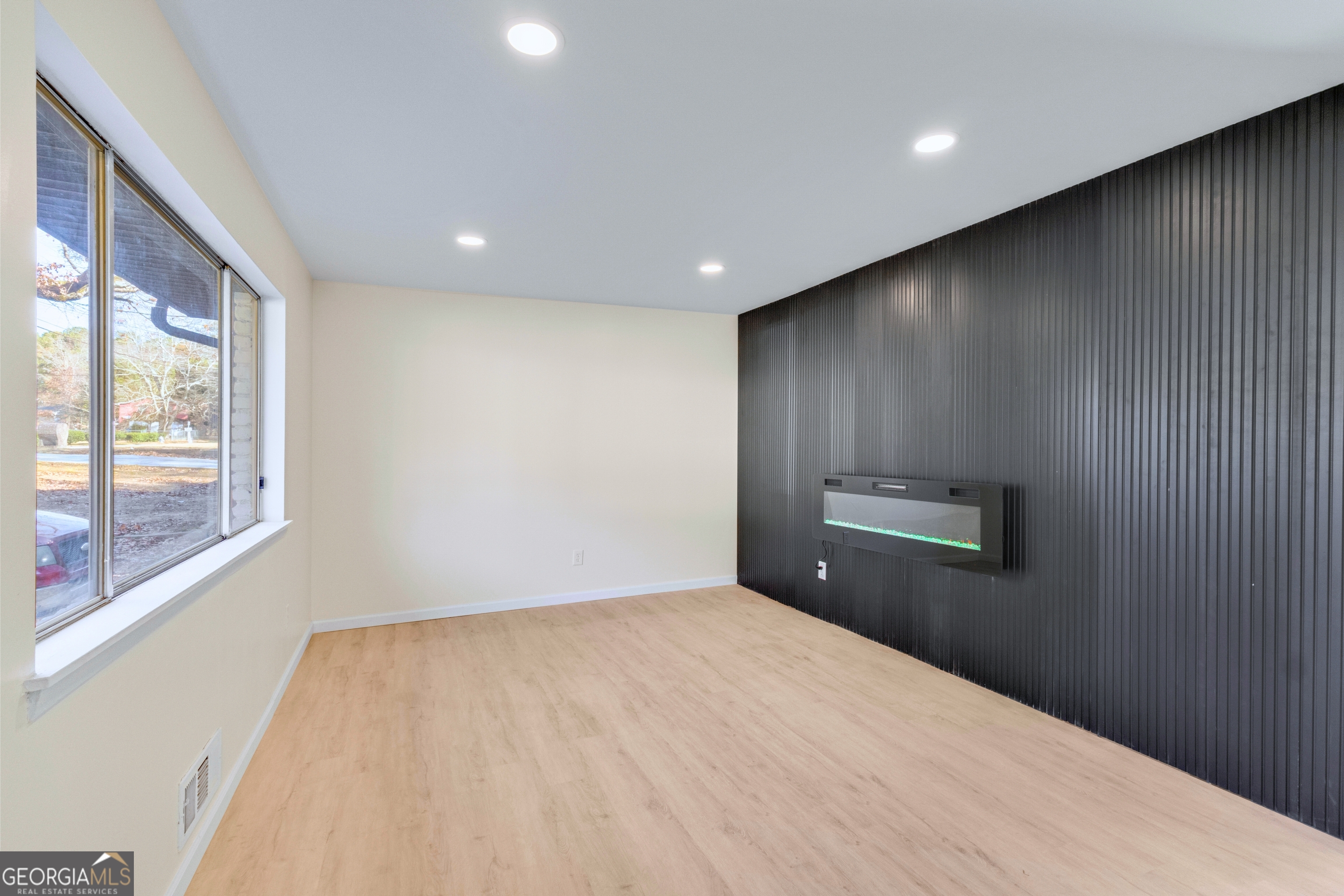 6695 Cedar Hurst Trail Atlanta, GA 30349 - Photo 3 of 23 a view of empty room with windows