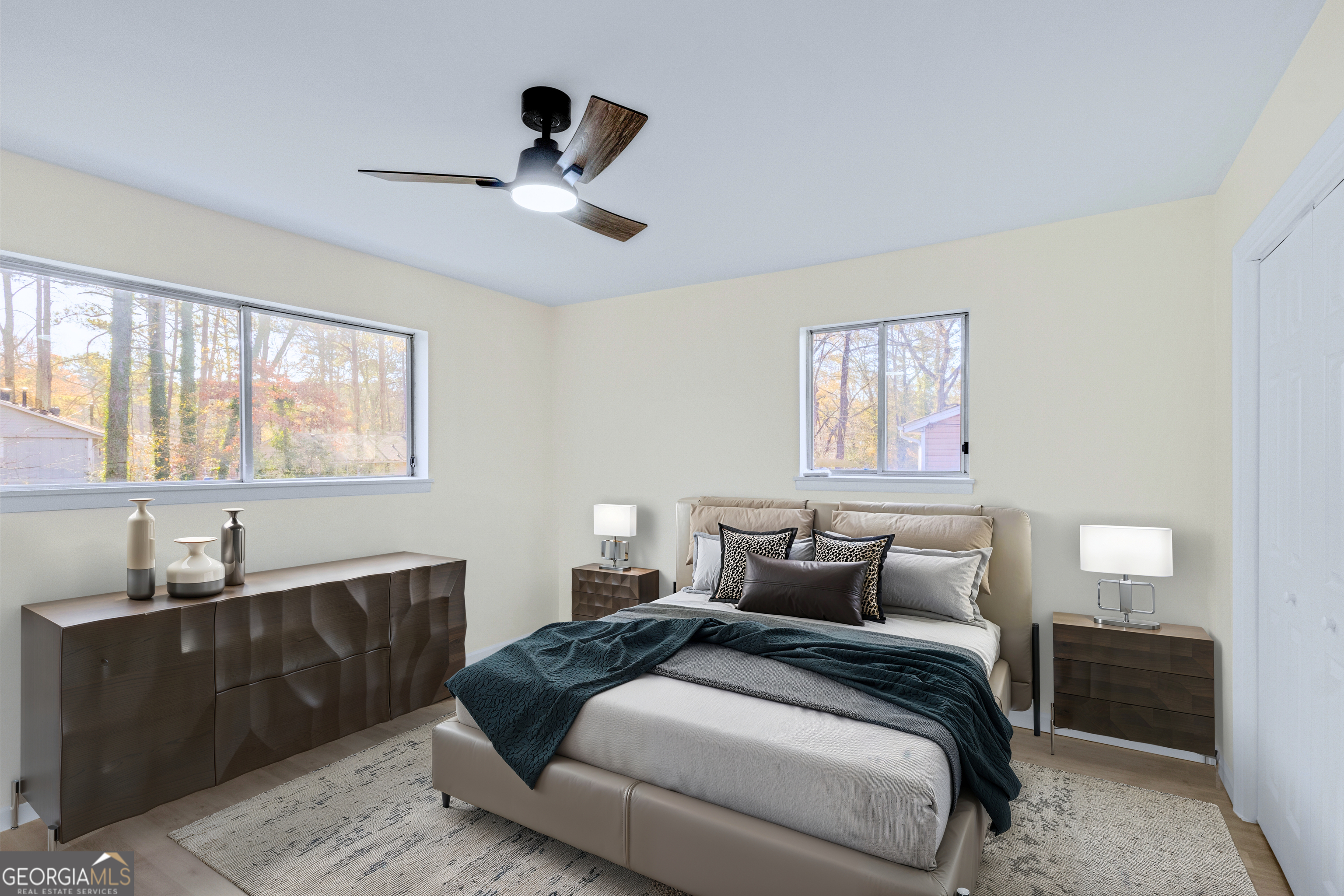 6695 Cedar Hurst Trail Atlanta, GA 30349 - Photo 5 of 23 a bedroom with a bed and wooden floor