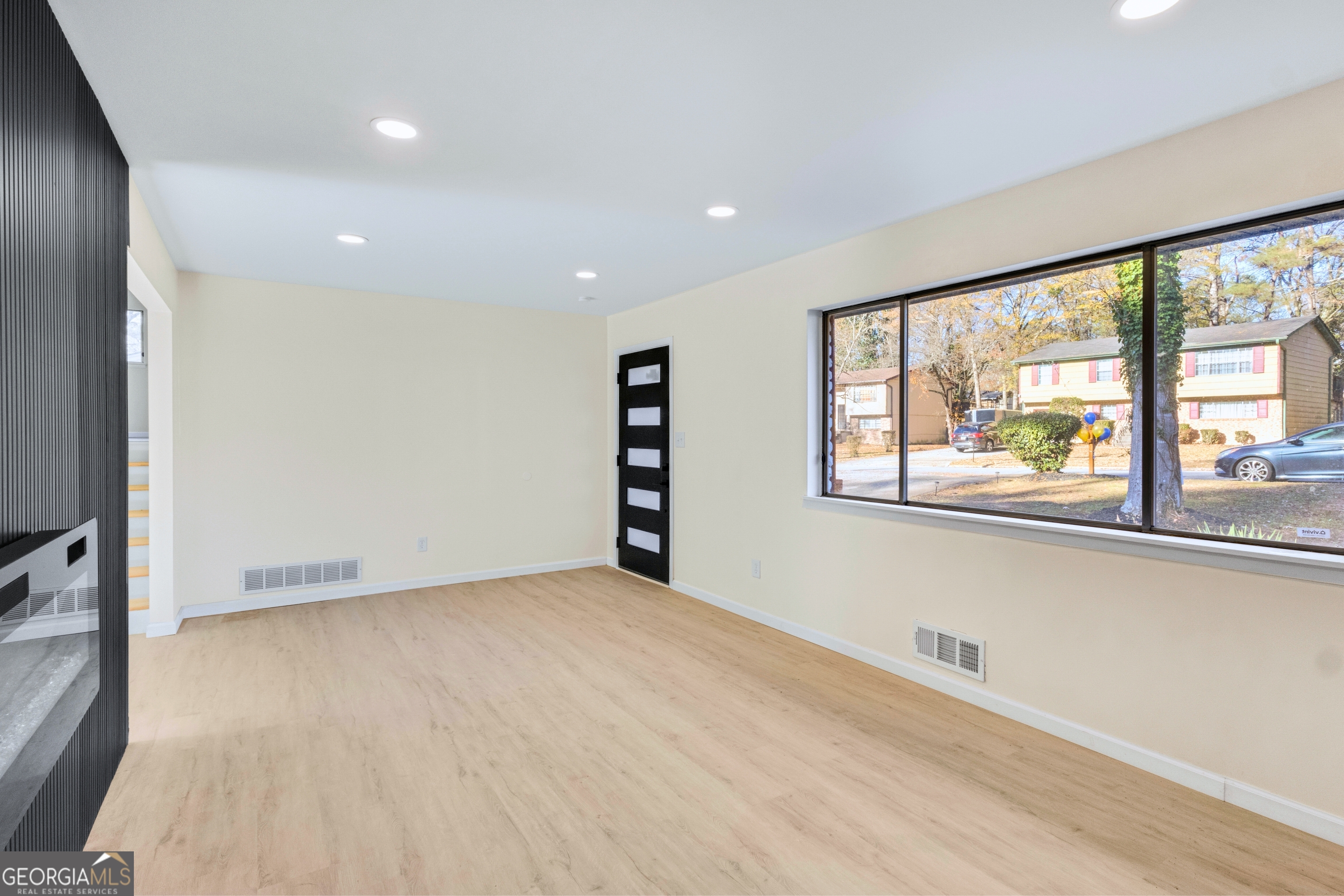 6695 Cedar Hurst Trail Atlanta, GA 30349 - Photo 7 of 23 a view of an empty room with a window
