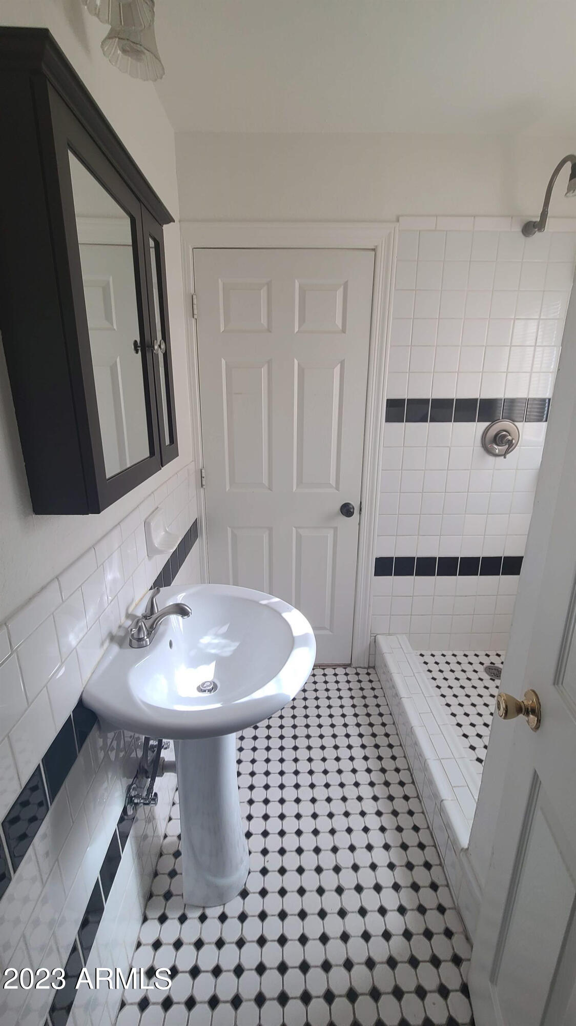1221 East Roosevelt Street, Unit B Phoenix, AZ 85006 - Photo 5 of 5 a bathroom with a sink a toilet and mirror