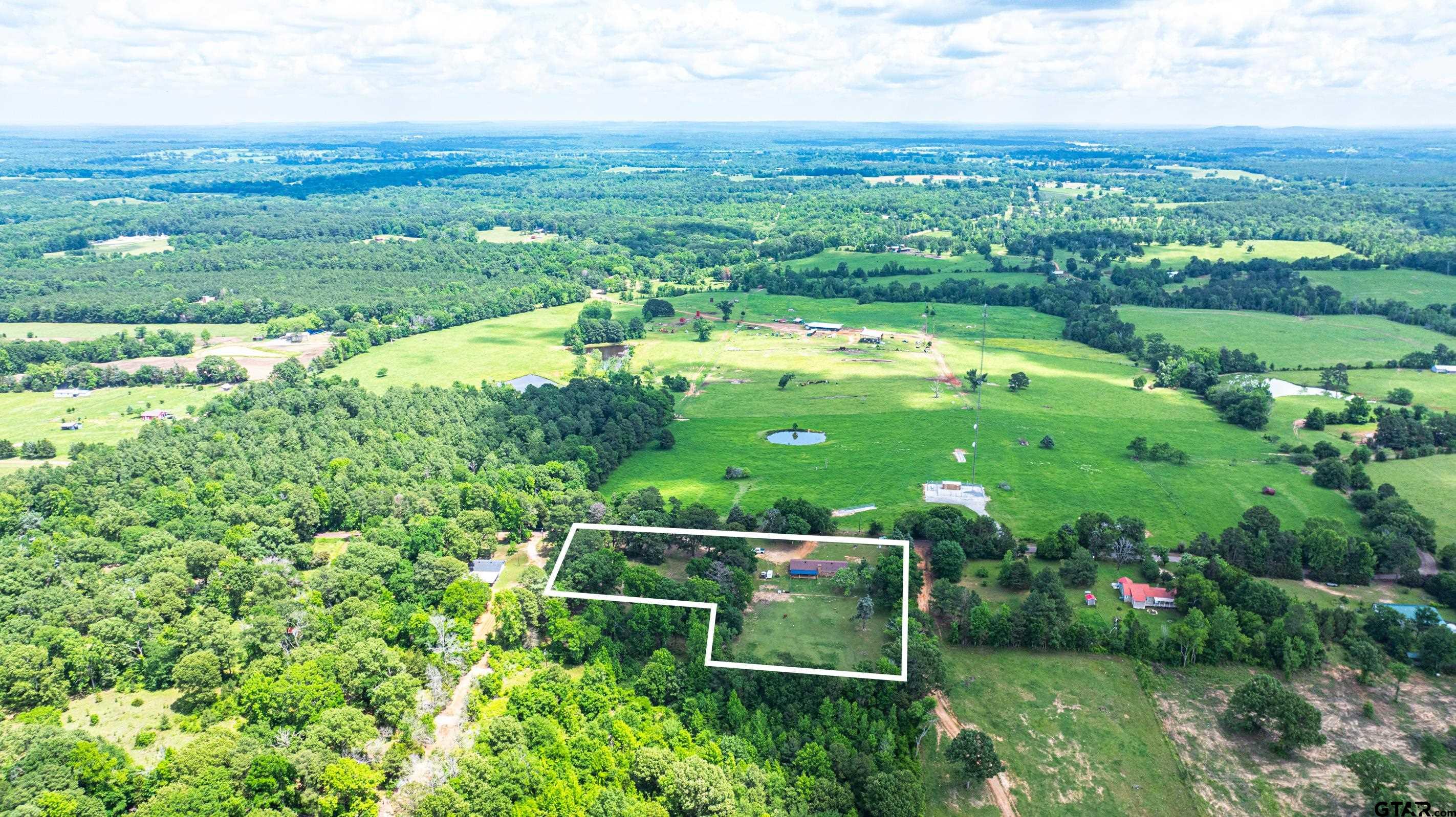 2536 Elk Road Gilmer, TX 75644 - Photo 27 of 32 a view of a city with lush green forest