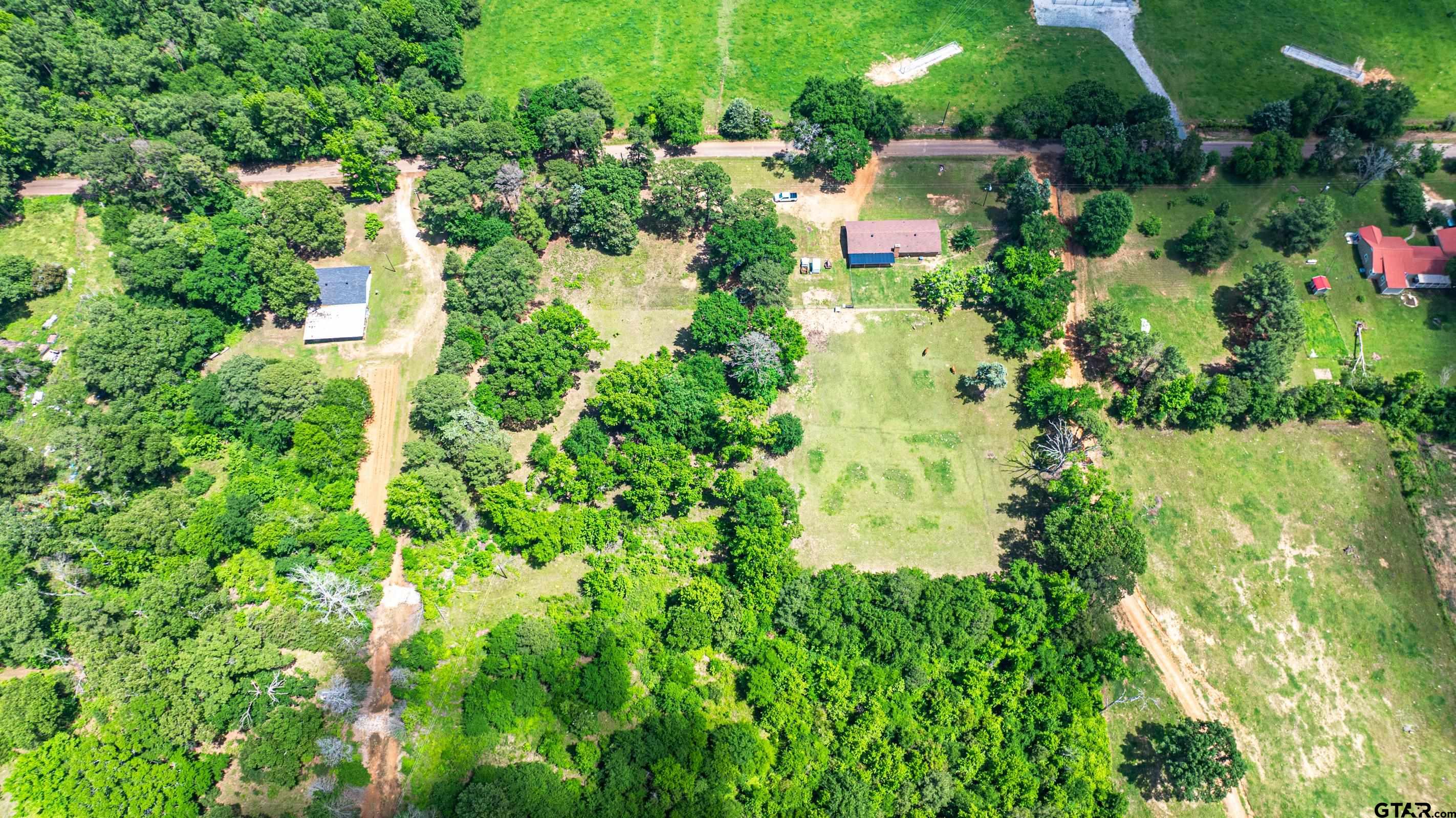 2536 Elk Road Gilmer, TX 75644 - Photo 31 of 32 an aerial view of a house with a yard and lake view