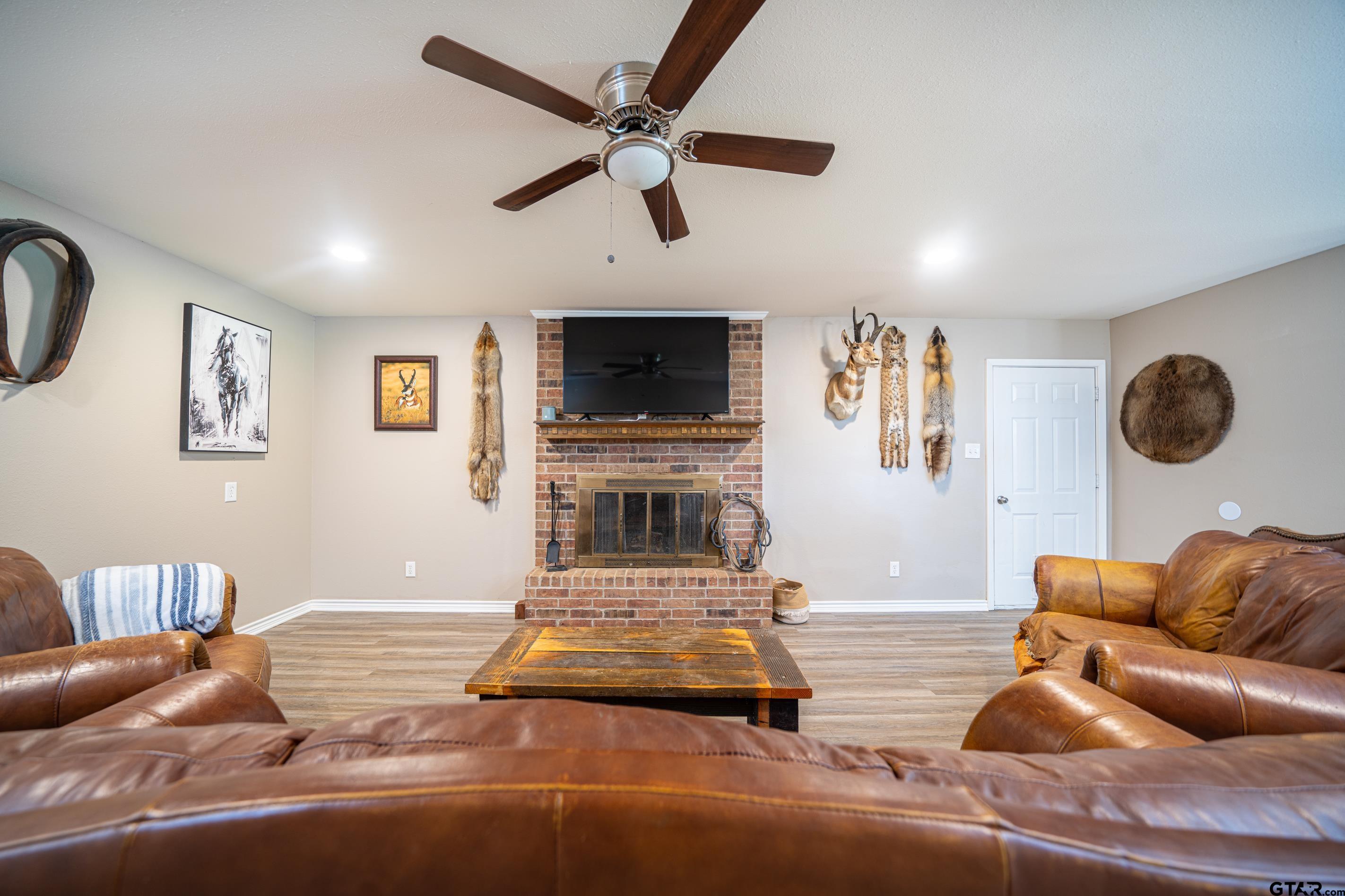 2536 Elk Road Gilmer, TX 75644 - Photo 6 of 32 a living room with furniture and a flat screen tv