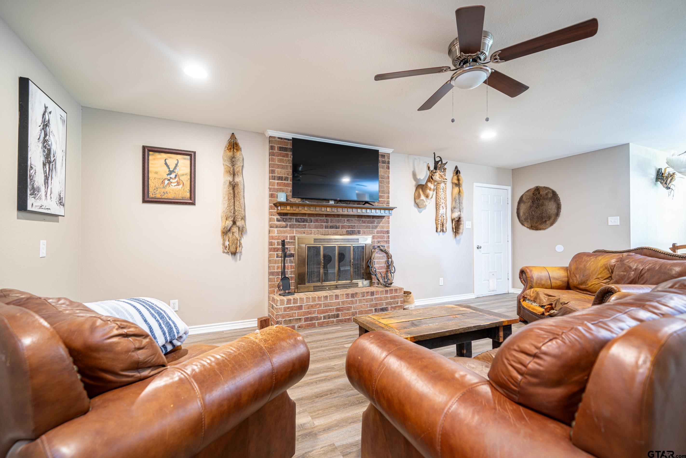 2536 Elk Road Gilmer, TX 75644 - Photo 7 of 32 a living room with furniture and a flat screen tv