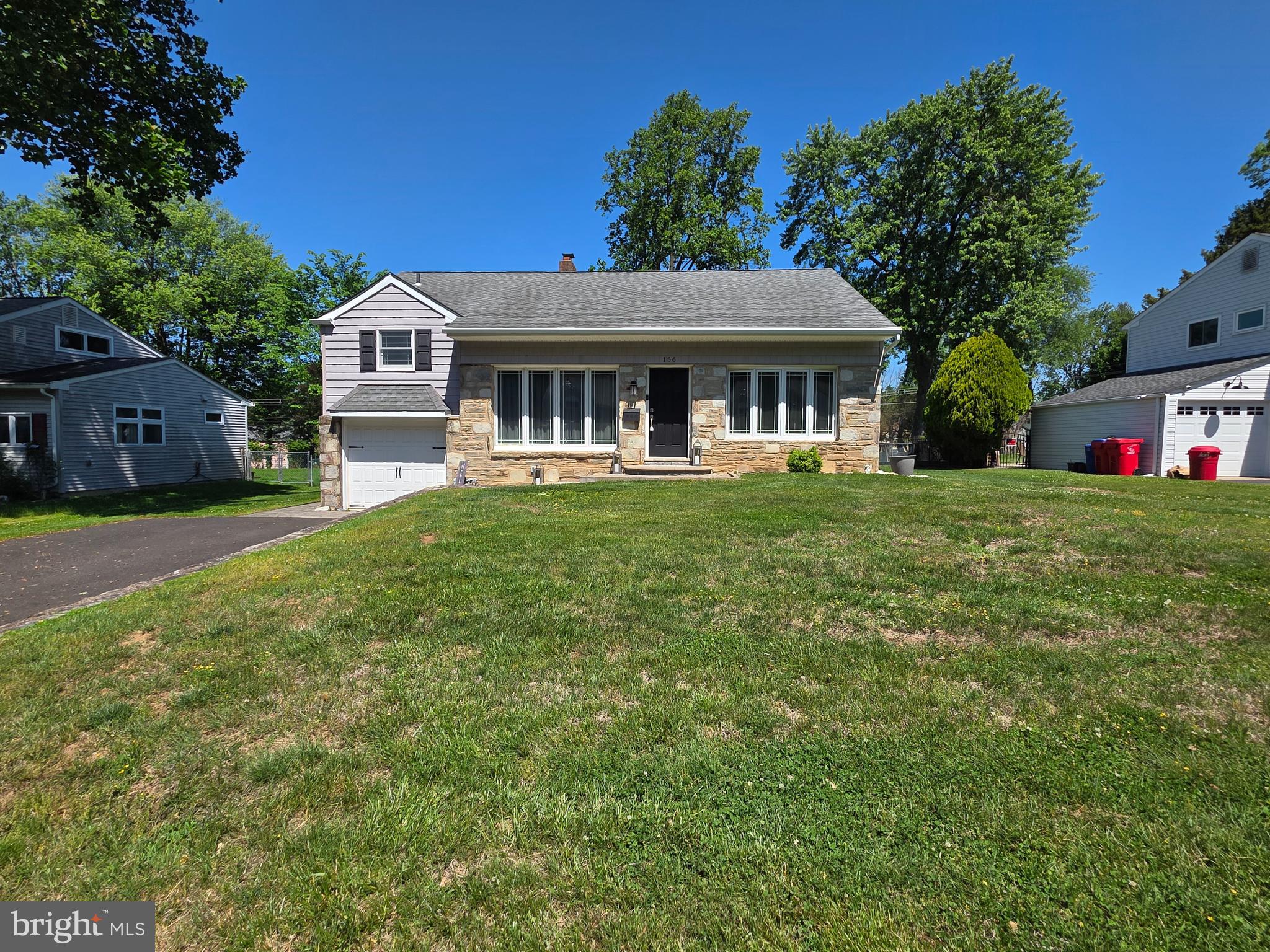 156 Crockett Road Warminster, PA 18974 - Photo 1 of 57 a front view of a house with a garden