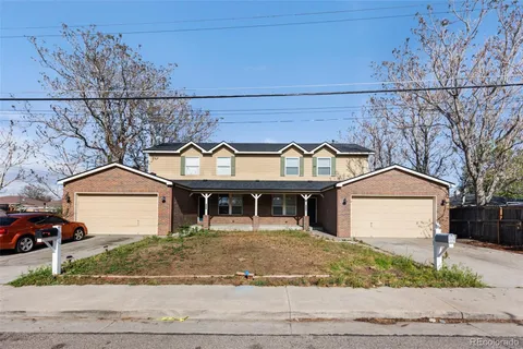 a front view of a house with garage and garage