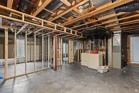 a view of an empty room with wooden walls