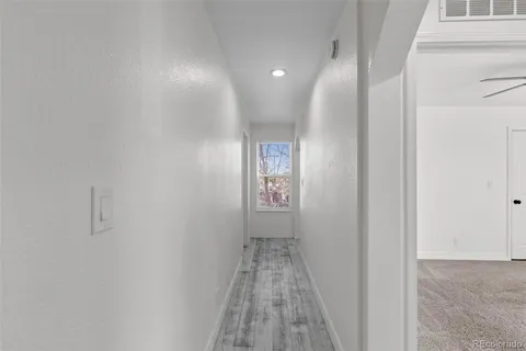 a view of hallway with windows