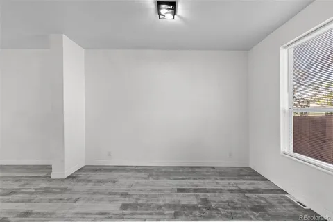 a view of an empty room and window