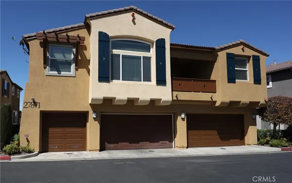 a front view of a house with a garage