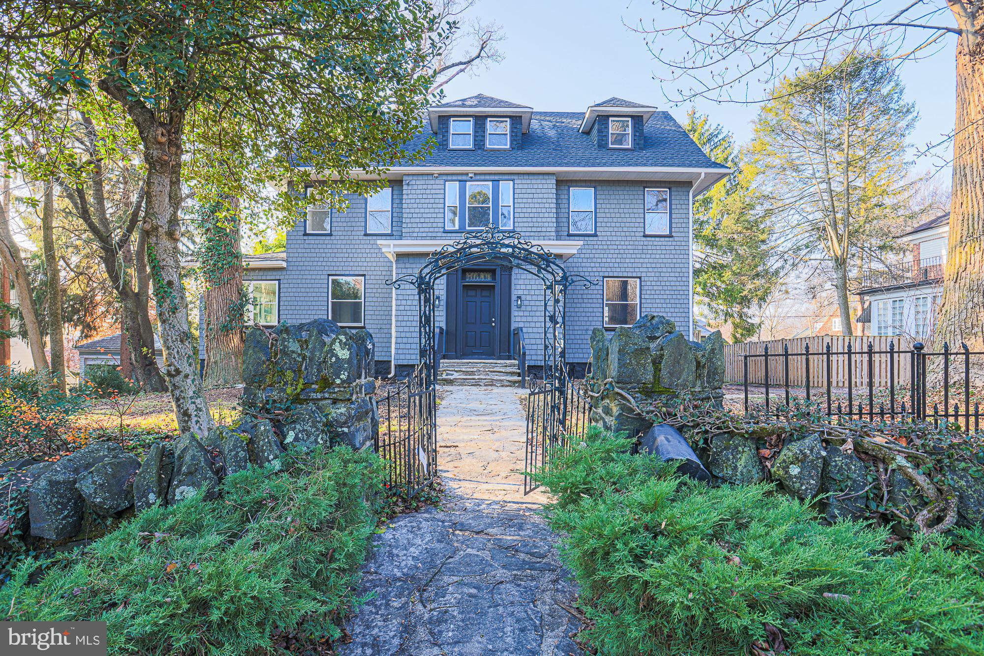 Charming home with inviting stone pathway.
