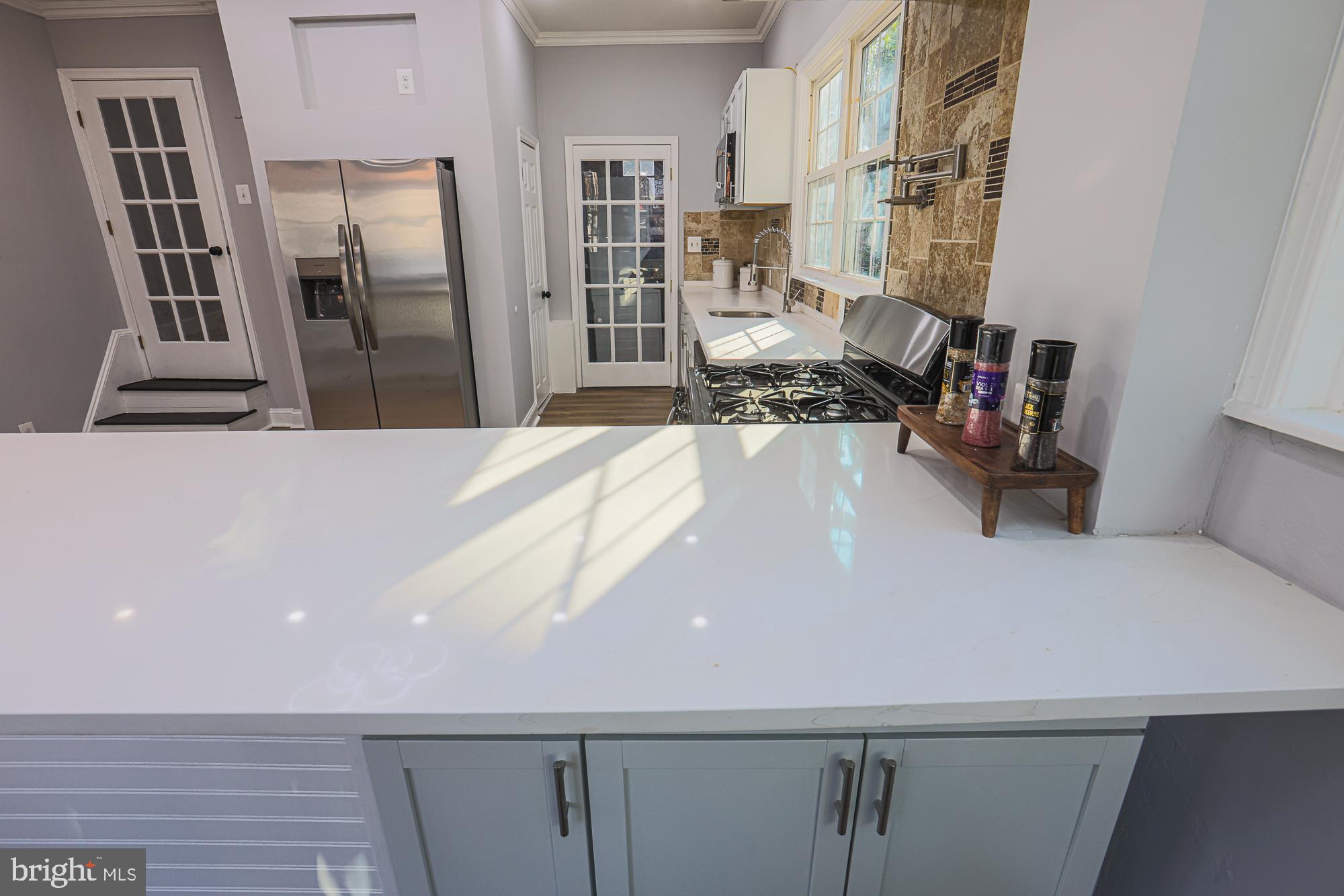 2606 Queen Anne Road Baltimore, MD 21216 - Photo 16 of 92 Bright and airy kitchen with modern finishes.