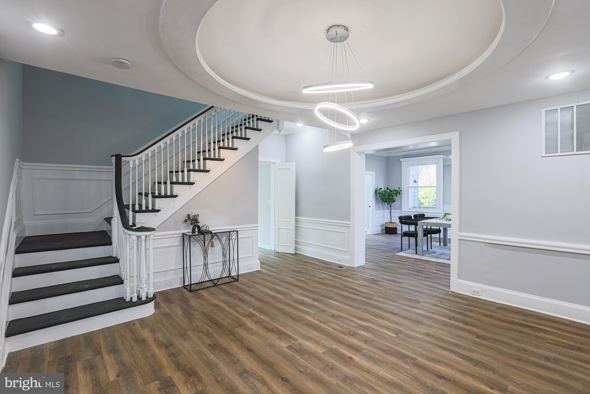 2606 Queen Anne Road Baltimore, MD 21216 - Photo 19 of 92 a view of a livingroom with wooden floor and furniture
