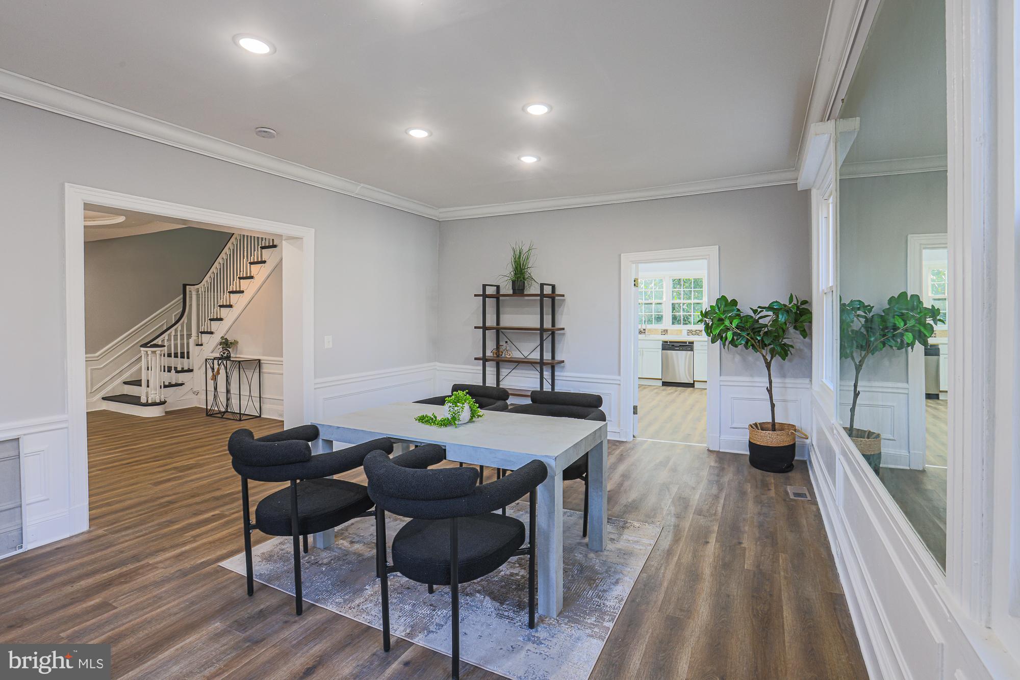 2606 Queen Anne Road Baltimore, MD 21216 - Photo 25 of 92 a view of a dining room with furniture and wooden floor