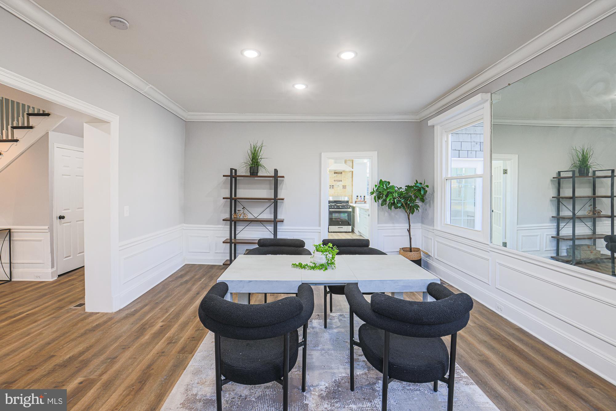 2606 Queen Anne Road Baltimore, MD 21216 - Photo 26 of 92 a view of a dining room with furniture and wooden floor