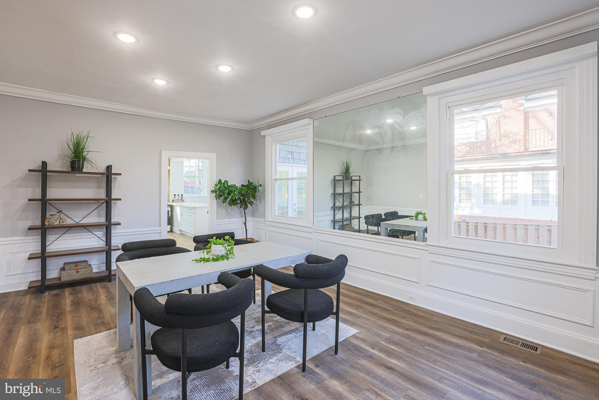 2606 Queen Anne Road Baltimore, MD 21216 - Photo 27 of 92 a view of a dining room with furniture window and wooden floor