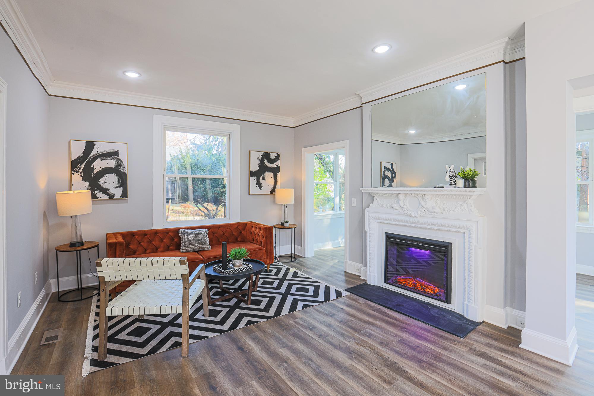 2606 Queen Anne Road Baltimore, MD 21216 - Photo 36 of 92 a living room with furniture and a fireplace