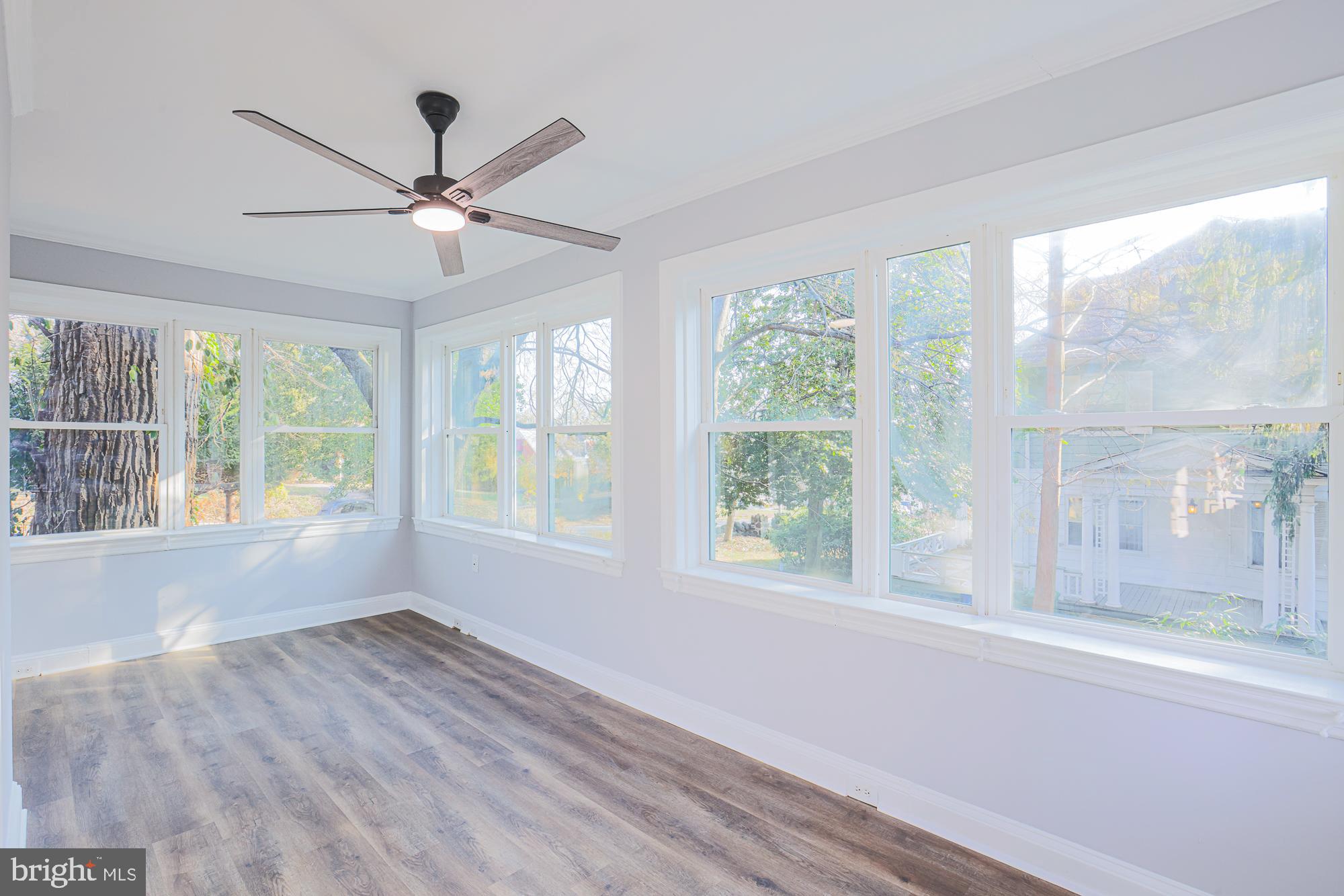 2606 Queen Anne Road Baltimore, MD 21216 - Photo 41 of 92 a view of a livingroom with a ceiling fan and a large window