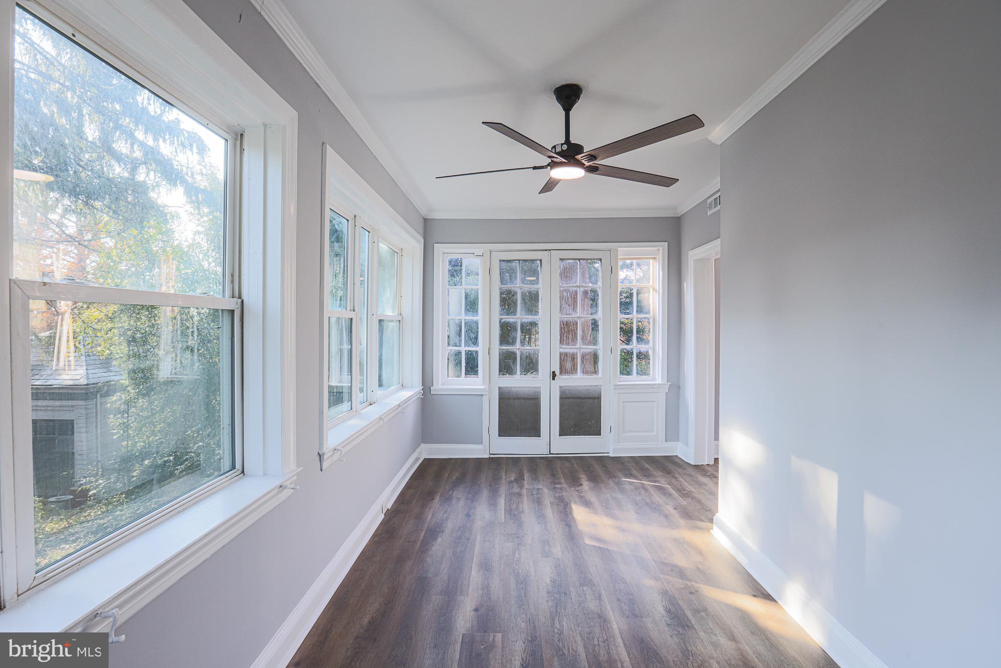 2606 Queen Anne Road Baltimore, MD 21216 - Photo 43 of 92 a view of empty room with wooden floor and fan