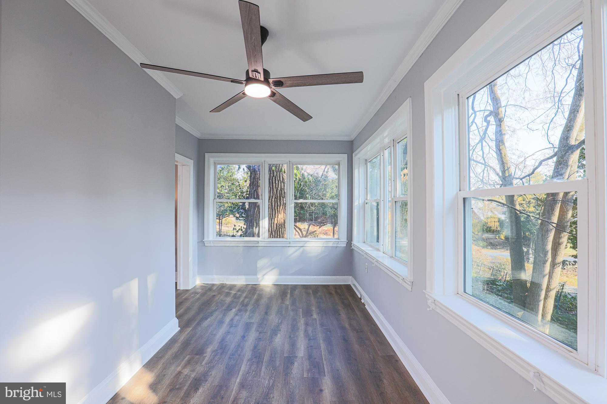 2606 Queen Anne Road Baltimore, MD 21216 - Photo 44 of 92 a view of an empty room with wooden floor and a window
