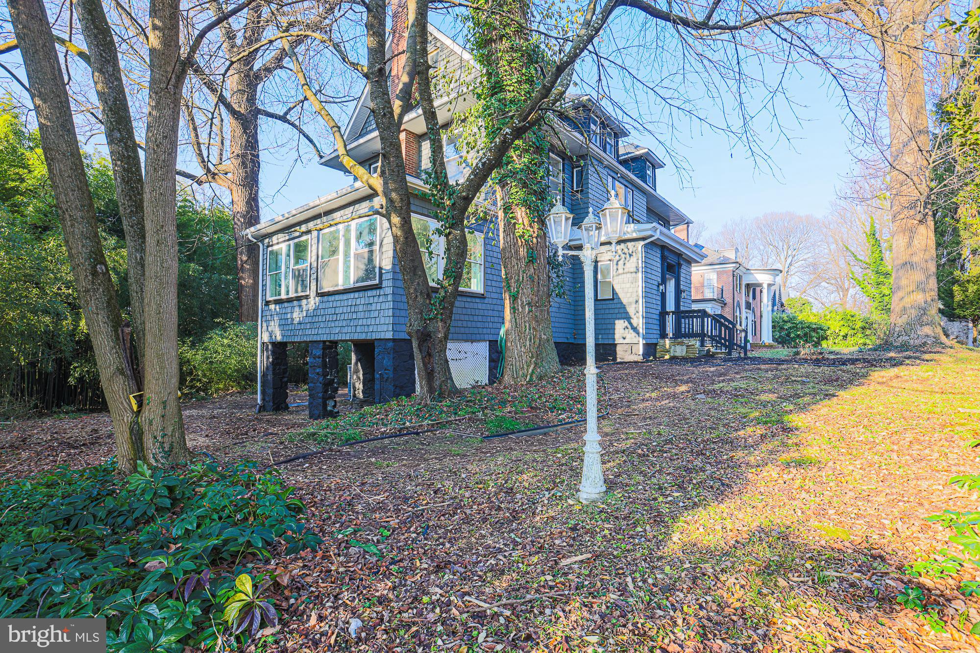 2606 Queen Anne Road Baltimore, MD 21216 - Photo 45 of 92 a view of a big house with a tree in front of it