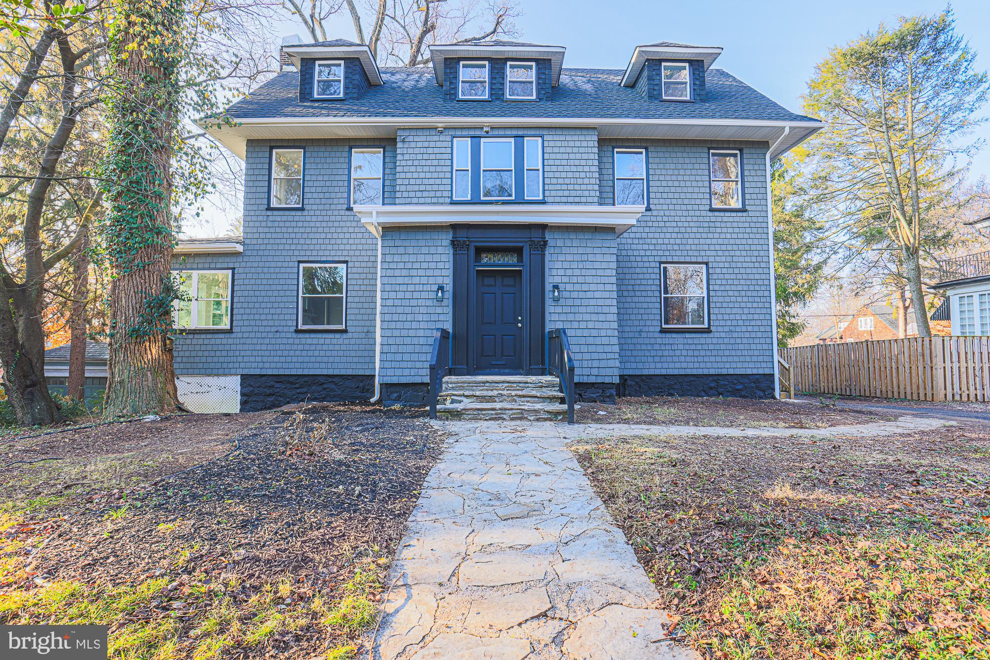 2606 Queen Anne Road Baltimore, MD 21216 - Photo 5 of 92 a view of a brick house with large windows