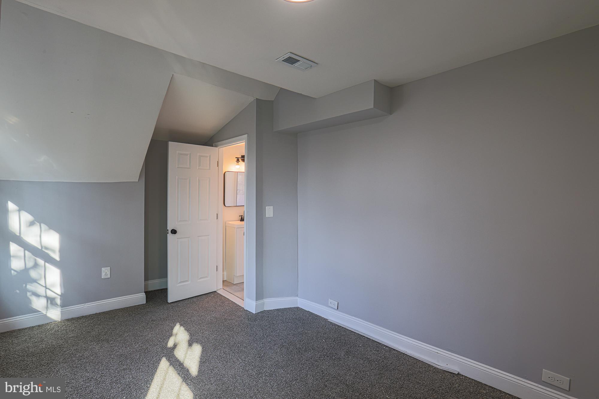 2606 Queen Anne Road Baltimore, MD 21216 - Photo 57 of 92 Cozy attic retreat with natural light.