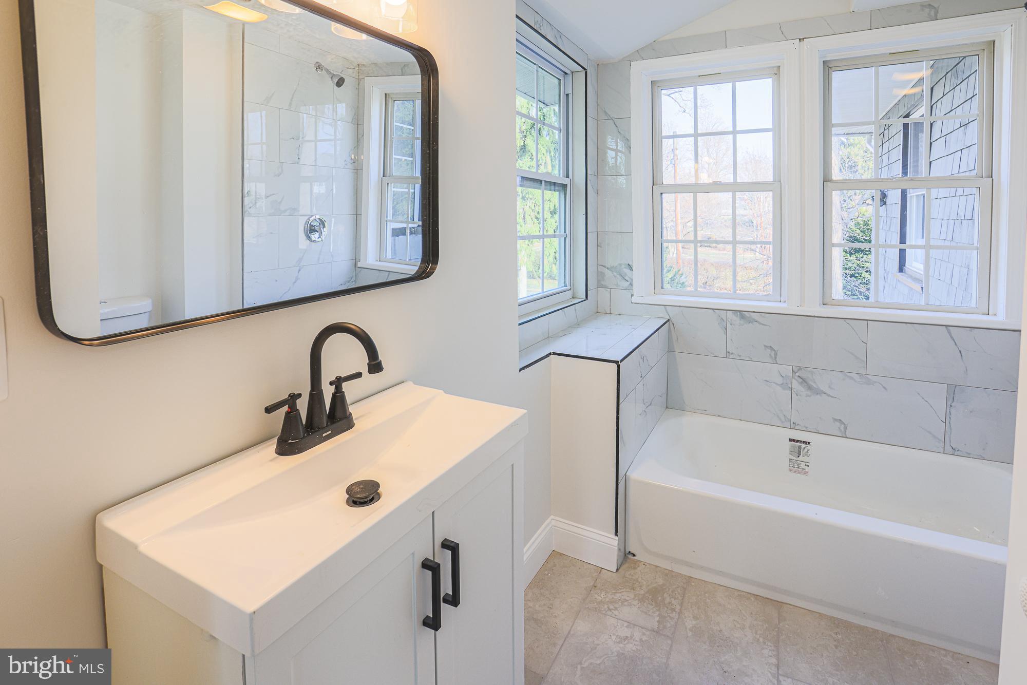 2606 Queen Anne Road Baltimore, MD 21216 - Photo 60 of 92 a bathroom with a sink and a bathtub