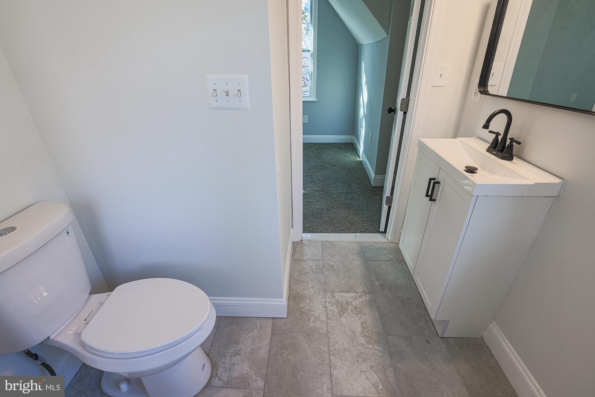 2606 Queen Anne Road Baltimore, MD 21216 - Photo 63 of 92 Modern bathroom with sleek finishes.