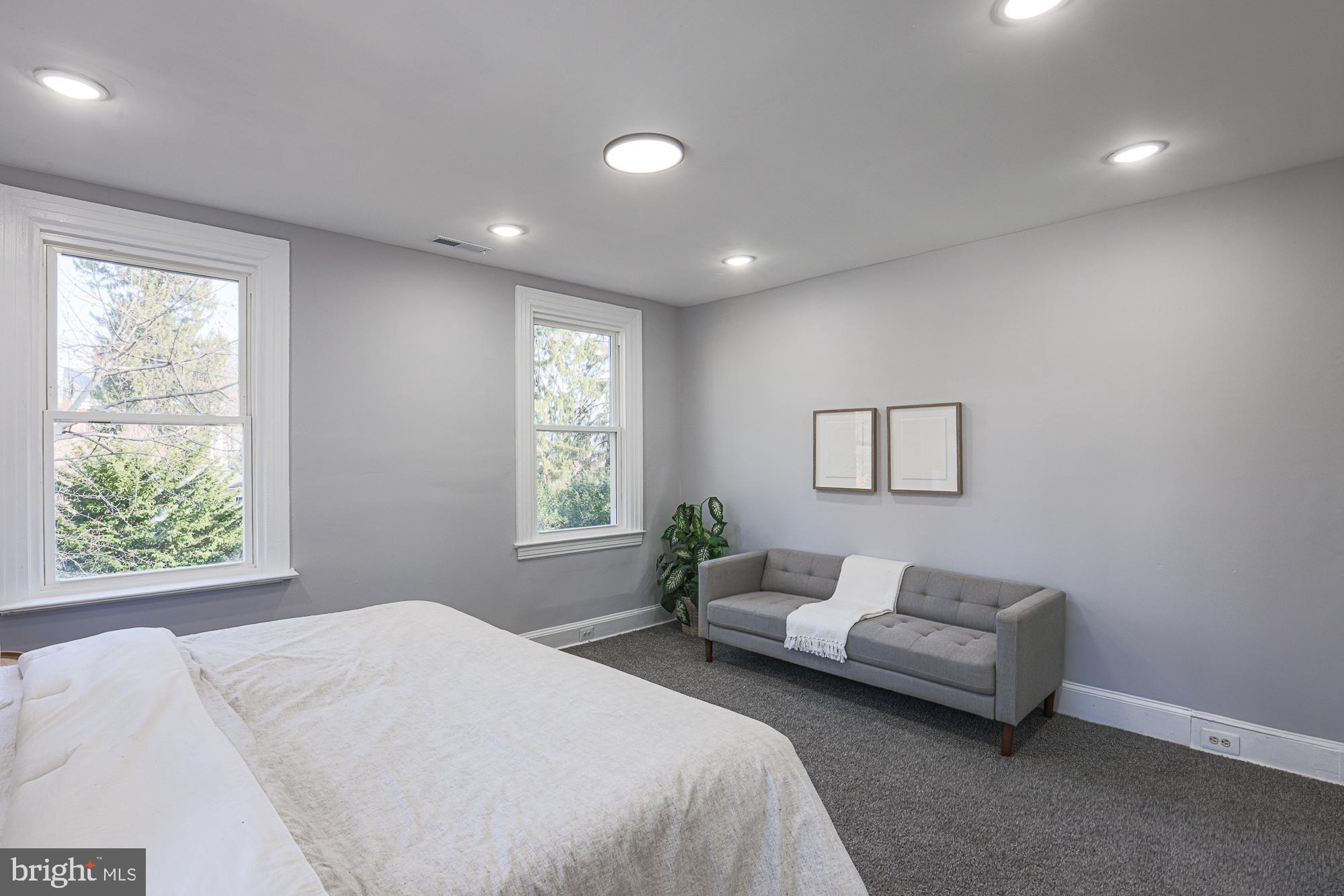 2606 Queen Anne Road Baltimore, MD 21216 - Photo 65 of 92 a bedroom with a bed and a couch