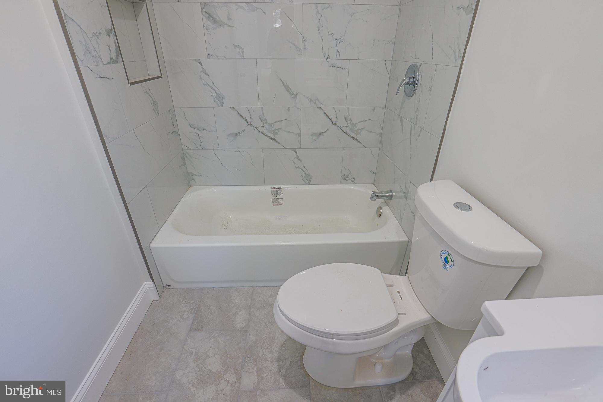2606 Queen Anne Road Baltimore, MD 21216 - Photo 72 of 92 Modern bathroom with elegant marble tiles.