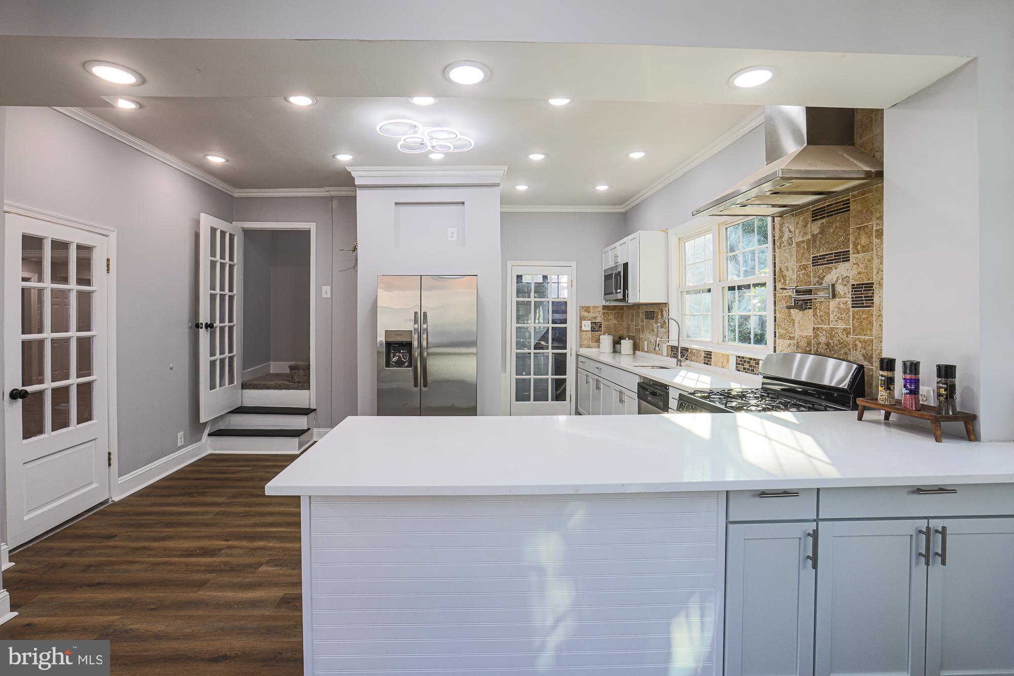 2606 Queen Anne Road Baltimore, MD 21216 - Photo 8 of 92 Modern kitchen with sleek finishes and light.