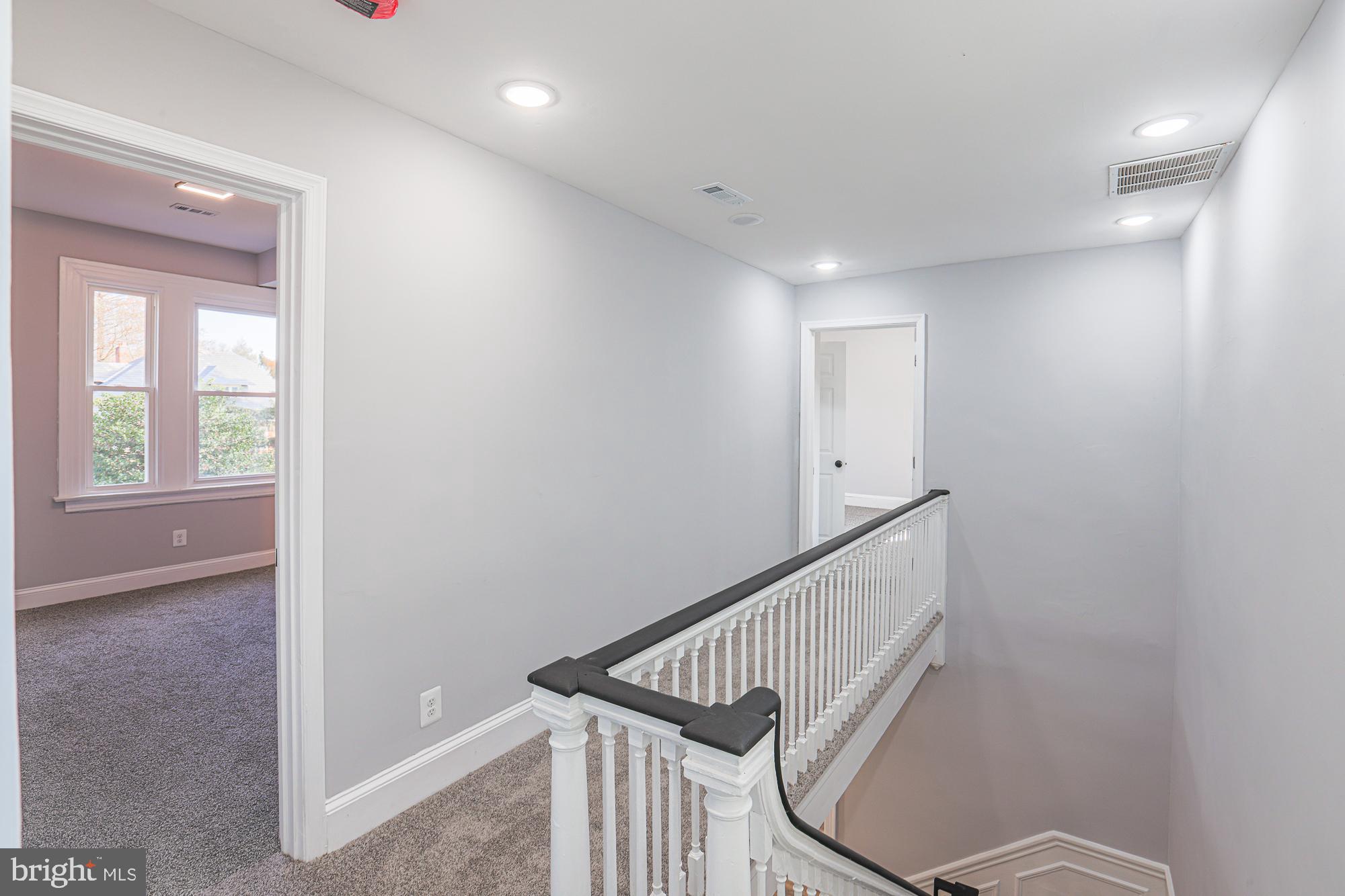 2606 Queen Anne Road Baltimore, MD 21216 - Photo 81 of 92 a view of a hallway with staircase