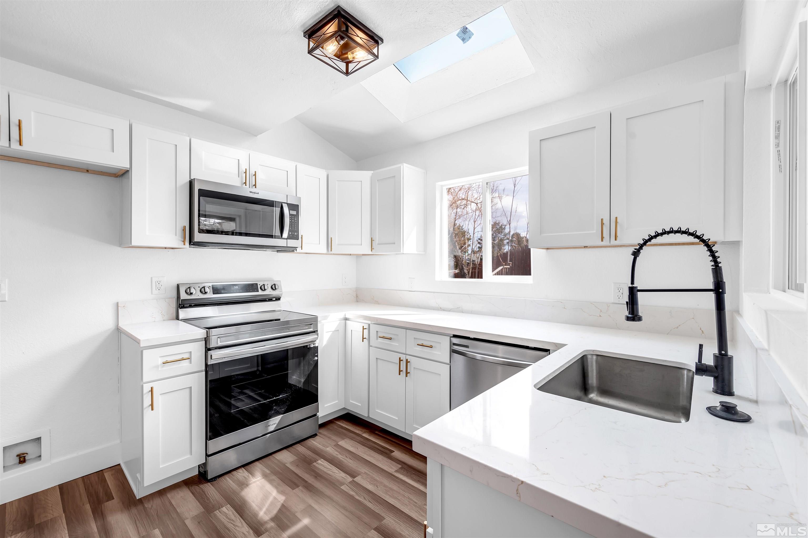 6768 Peppermint Court Reno, NV 89506 - Photo 1 of 40 a kitchen with a sink cabinets and stainless steel appliances