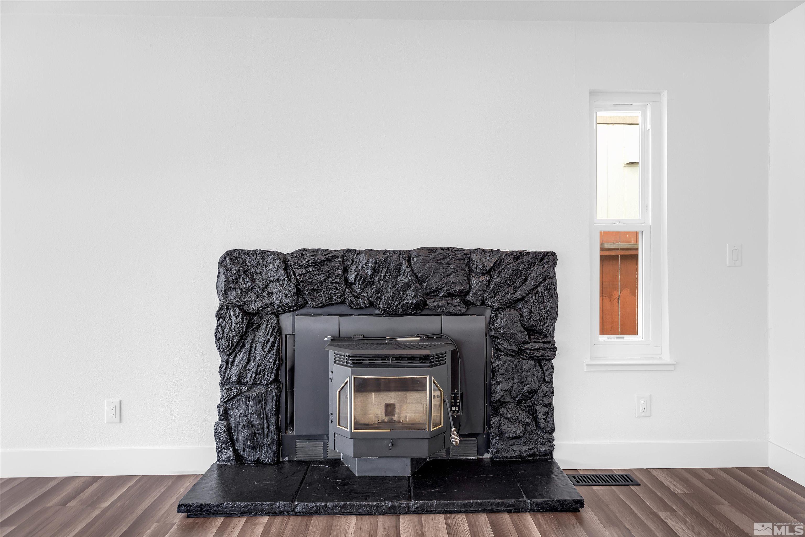 6768 Peppermint Court Reno, NV 89506 - Photo 11 of 40 a living room with a fireplace