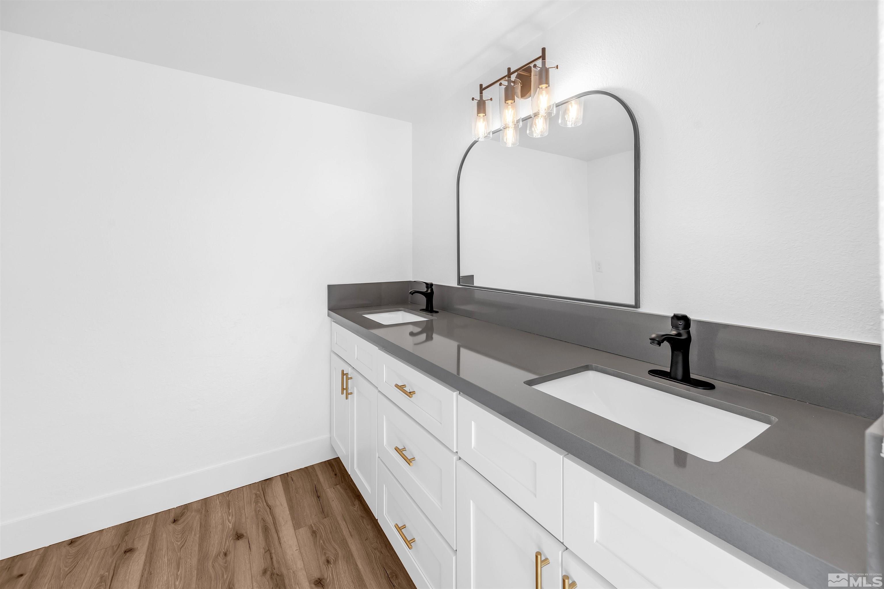 6768 Peppermint Court Reno, NV 89506 - Photo 21 of 40 a bathroom with a sink and a mirror