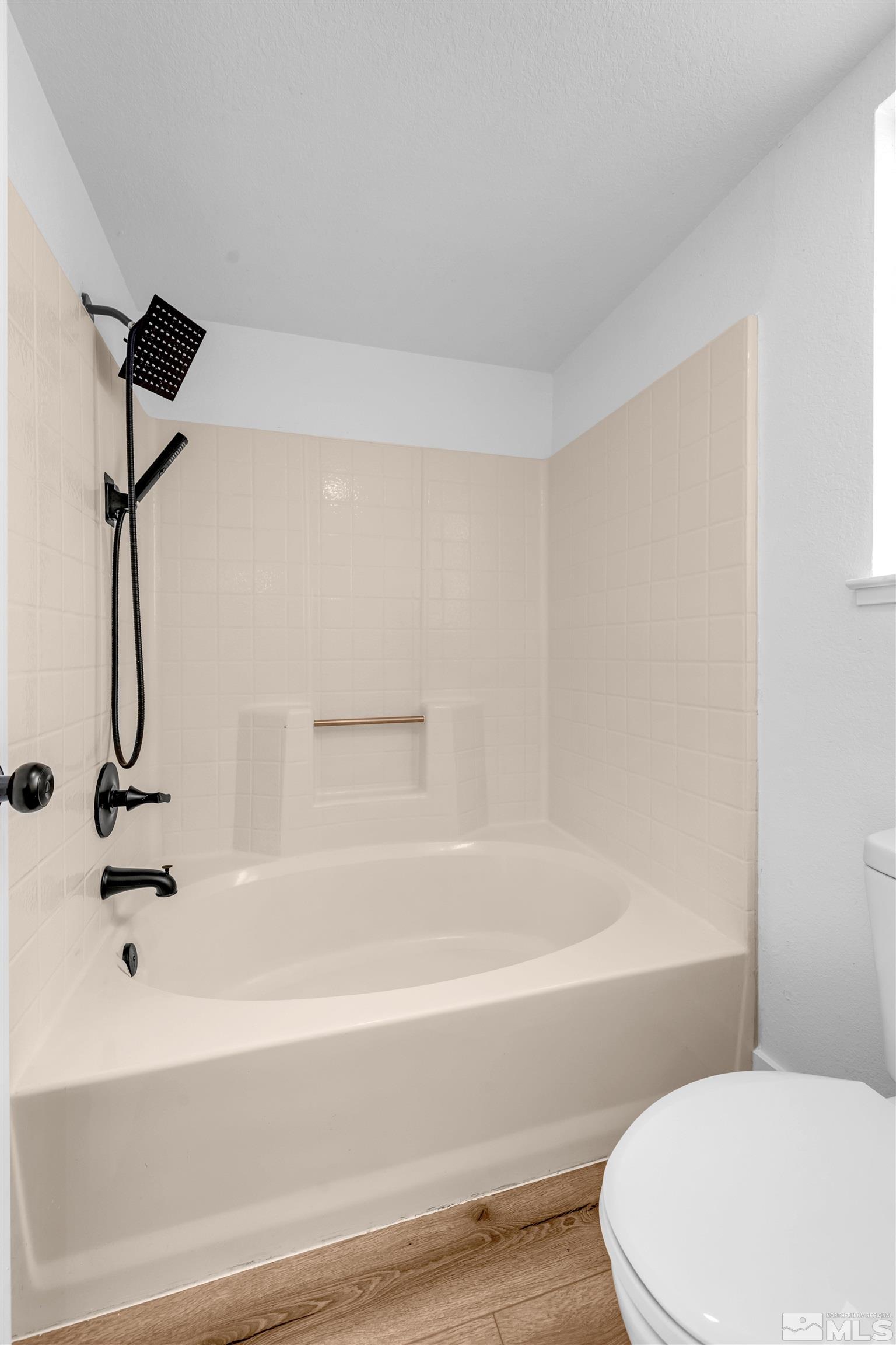 6768 Peppermint Court Reno, NV 89506 - Photo 23 of 40 a bathroom with a white bath tub and a shower