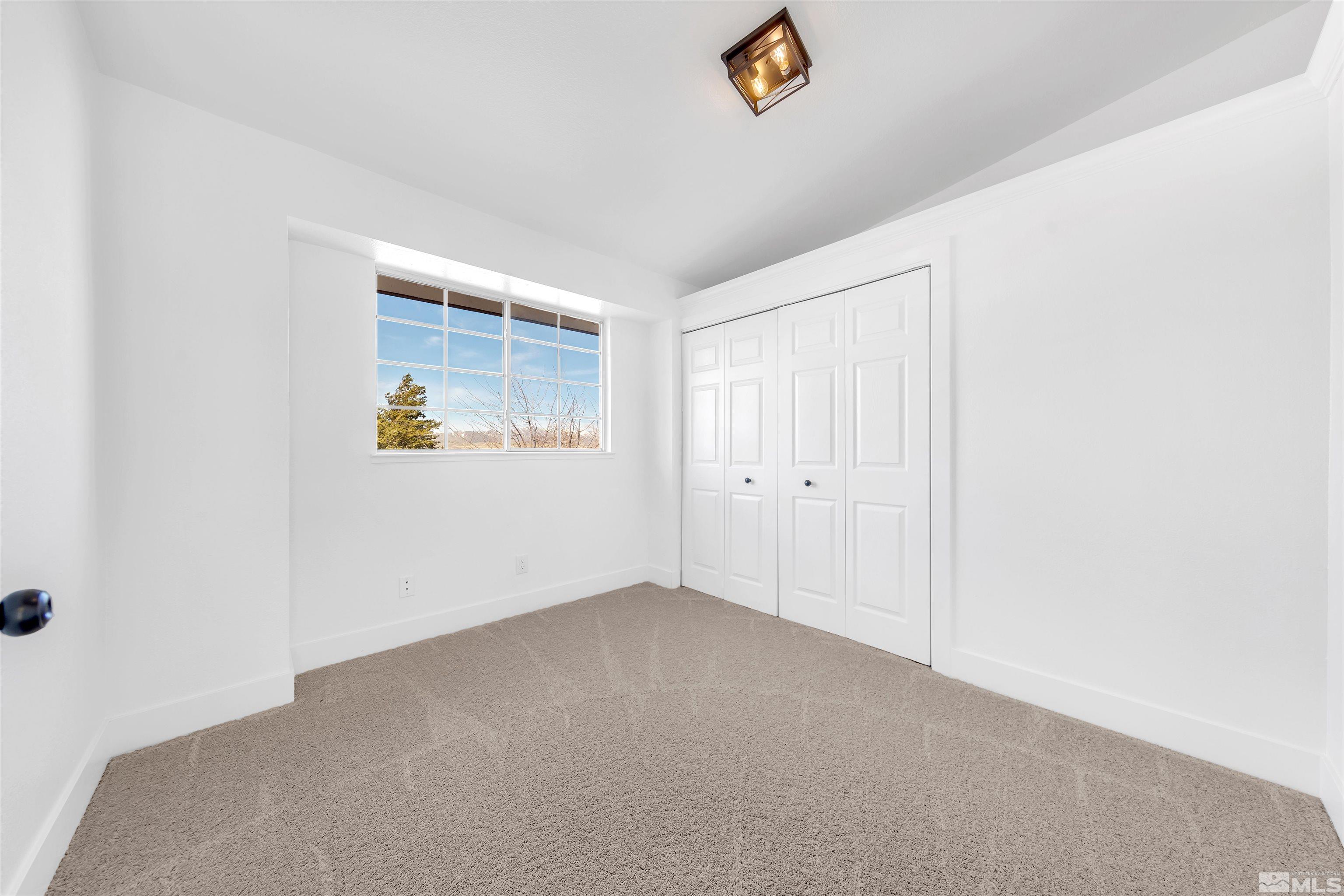 6768 Peppermint Court Reno, NV 89506 - Photo 27 of 40 an empty room with windows