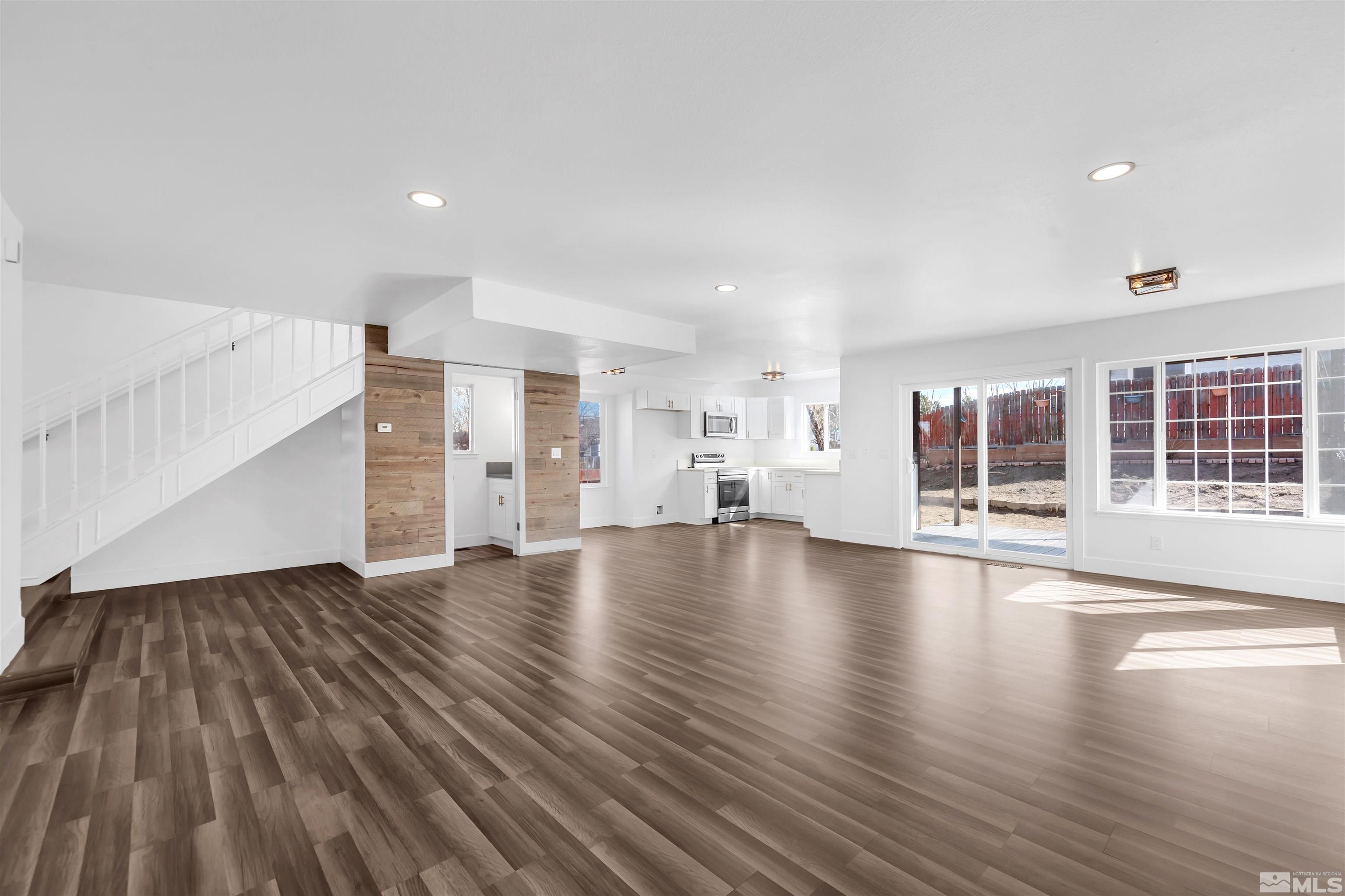 6768 Peppermint Court Reno, NV 89506 - Photo 4 of 40 a view of empty room with wooden floor and windows