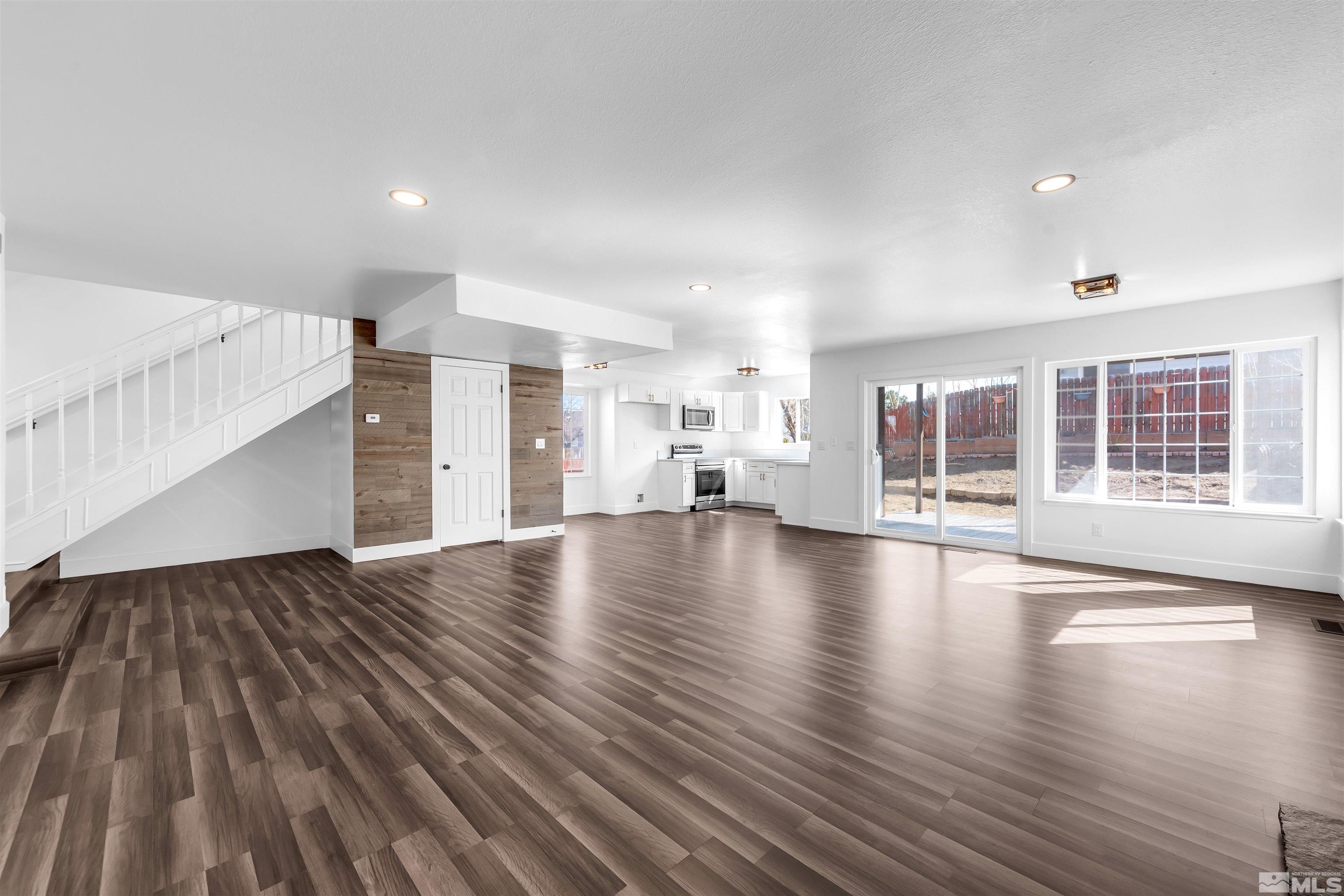 6768 Peppermint Court Reno, NV 89506 - Photo 10 of 40 a view of empty room with wooden floor and windows