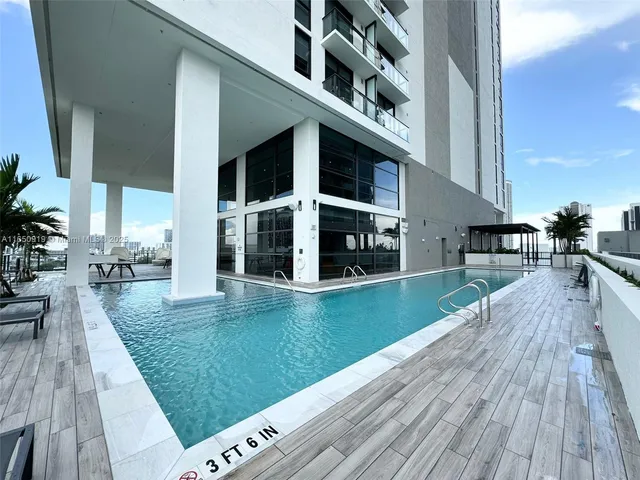 a view of a house with pool deck