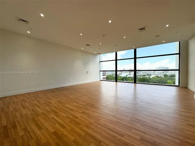 a view of room and hardwood floor