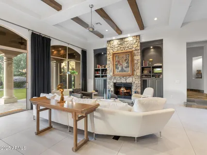a dining room with furniture and window