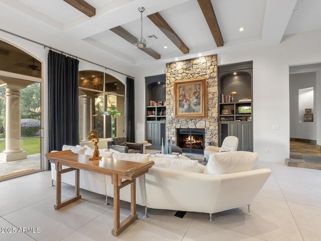 a dining room with furniture a livingroom and chandelier