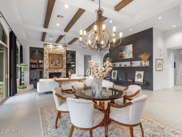 a living room with lots of furniture and a large window