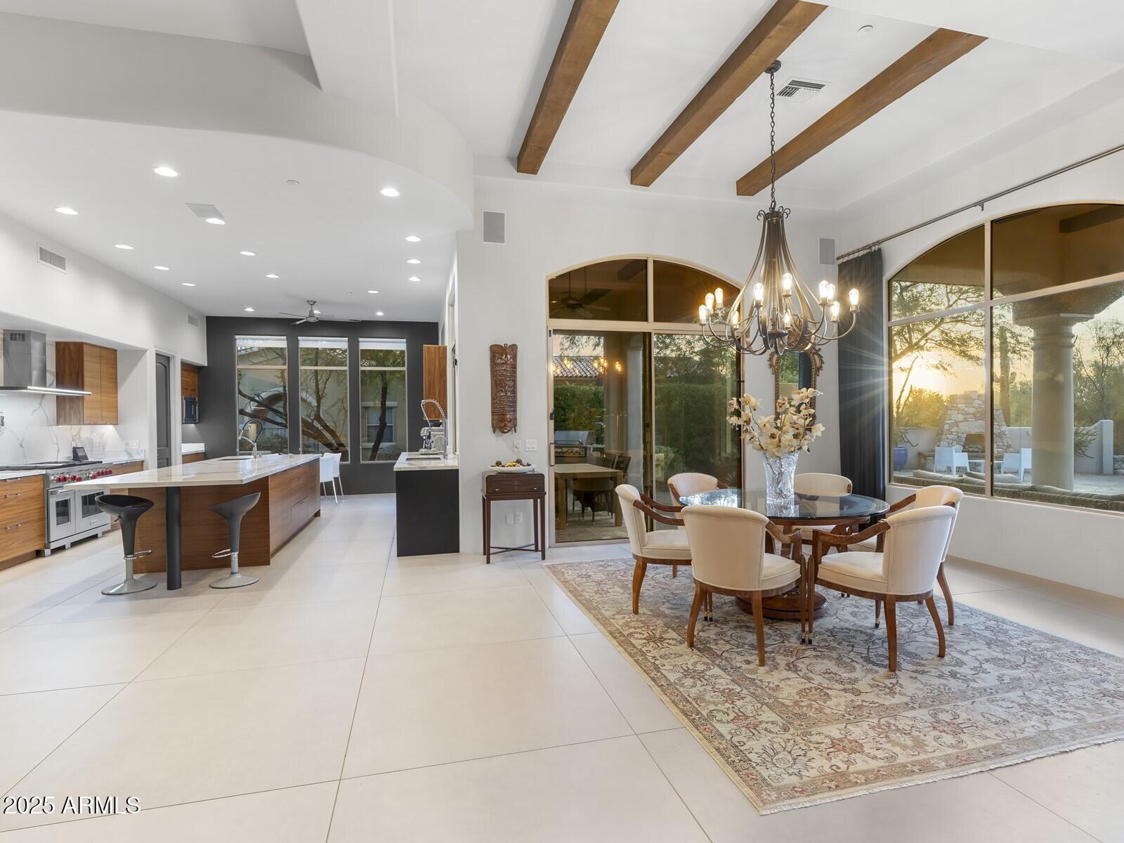9290 East Thompson Peak Parkway, Unit 142 Scottsdale, AZ 85255 - Photo 16 of 74 a living room with lots of furniture and a large window
