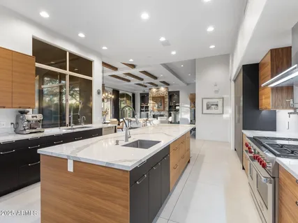 a view of a hallway with paintings on the wall